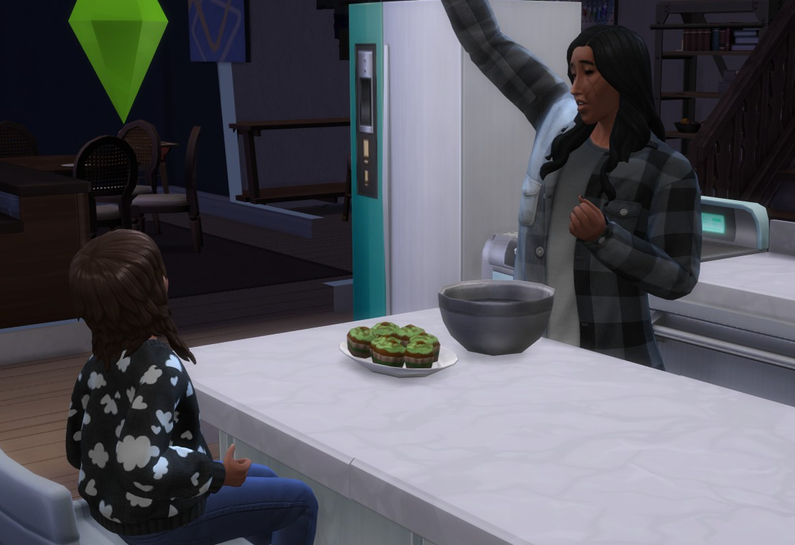 A Sims 4 screenshot, Doba, hand up in the air cheering, while he stirs a batter with a set of green cupcakes in front of that. Ajei watches.
